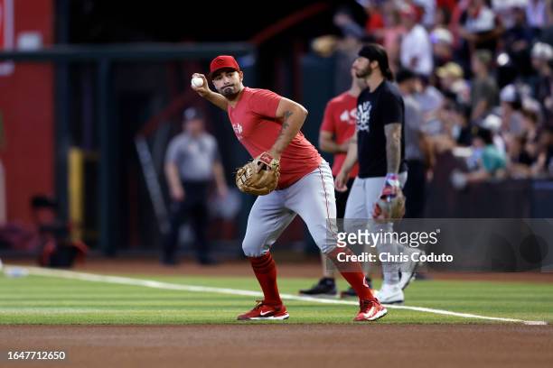 Christian Encarnacion-Strand of the Cincinnati Reds prepares for the game against the Arizona Diamondbacks at Chase Field on August 26, 2023 in...