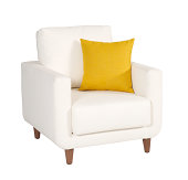 White armchair with small yellow pillow