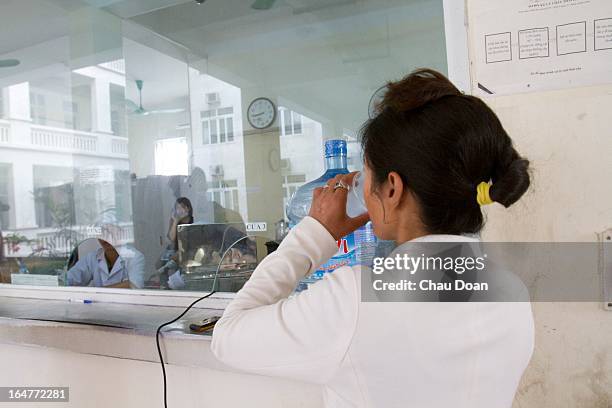 Female drug addict gets her daily methadone dose at the Long Bien District Health Center. Vietnam has many comprehensive health programs aimed at the...