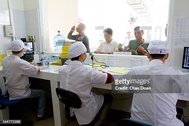Drug addicts get their daily methadone doses at the Long Bien District Health Center. Vietnam has many comprehensive health programs aimed at the...