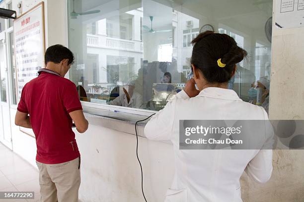 Female drug addict gets her daily methadone dose at the Long Bien District Health Center. Vietnam has many comprehensive health programs aimed at the...