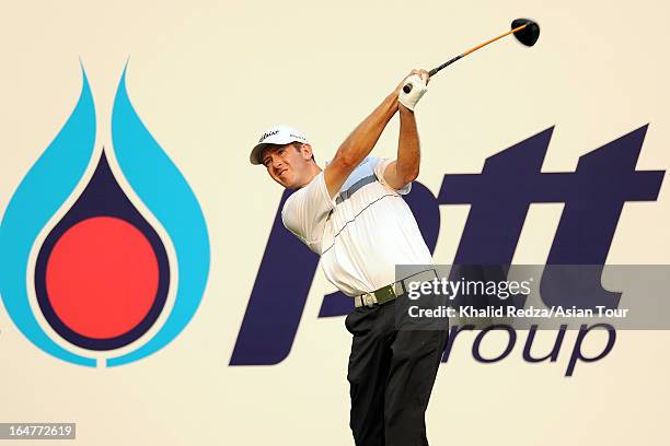 Jonathan Moore of USA plays a shot during round one of the Chiangmai Golf Classic at Alpine Golf Resort-Chiangmai on March 28, 2013 in Chiang Mai,...