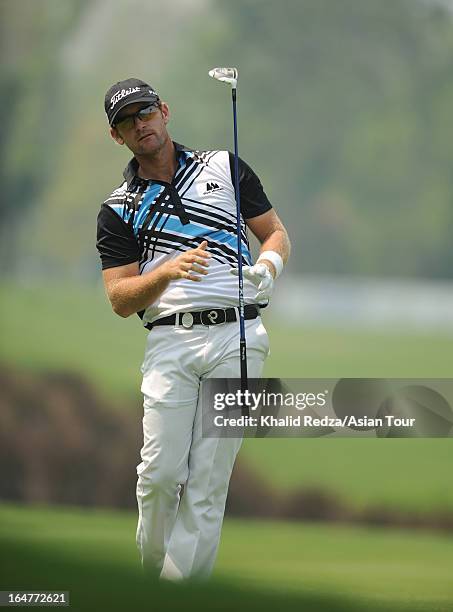 Berry Henson of USA plays a shot during round one of the Chiangmai Golf Classic at Alpine Golf Resort-Chiangmai on March 28, 2013 in Chiang Mai,...