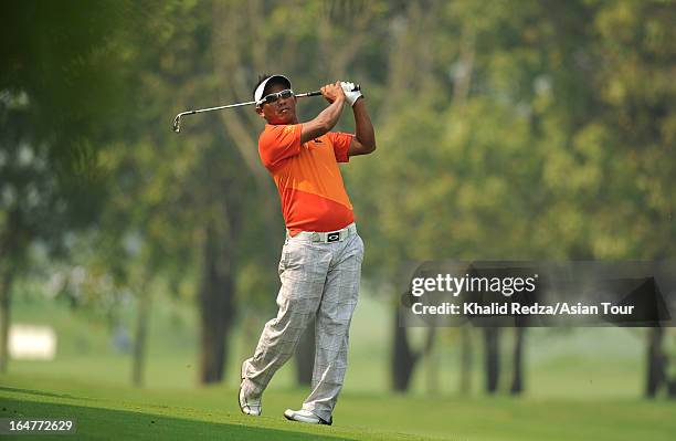 Thongchai Jaidee of Thailand plays a shot during round one of the Chiangmai Golf Classic at Alpine Golf Resort-Chiangmai on March 28, 2013 in Chiang...