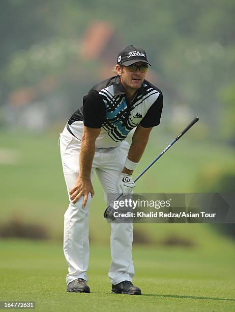 Berry Henson of USA plays a shot during round one of the Chiangmai Golf Classic at Alpine Golf Resort-Chiangmai on March 28, 2013 in Chiang Mai,...