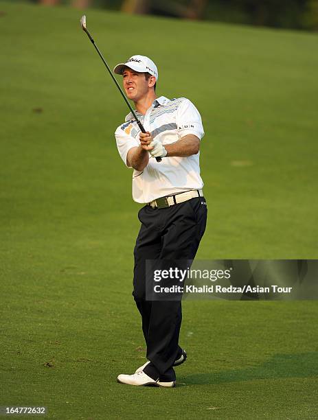 Jonathan Moore of USA plays a shot during round one of the Chiangmai Golf Classic at Alpine Golf Resort-Chiangmai on March 28, 2013 in Chiang Mai,...