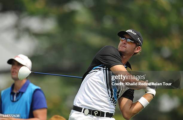 Berry Henson of USA plays a shot during round one of the Chiangmai Golf Classic at Alpine Golf Resort-Chiangmai on March 28, 2013 in Chiang Mai,...