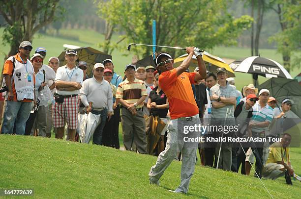 Thongchai Jaidee of Thailand plays a shot during round one of the Chiangmai Golf Classic at Alpine Golf Resort-Chiangmai on March 28, 2013 in Chiang...