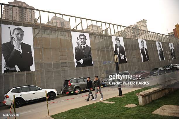 Posters of actors who have played James Bond are seen outside an exhibition on the fictional British spy in Shanghai on March 28, 2013. The...