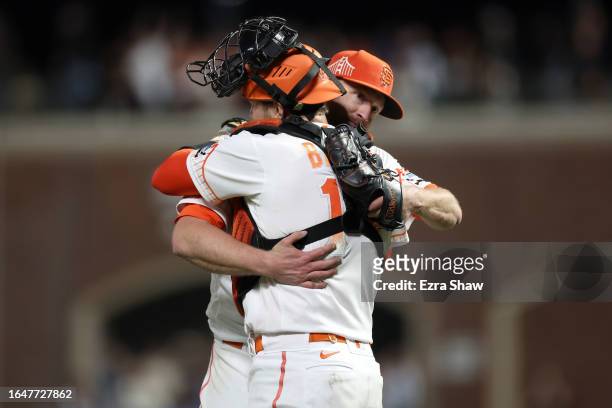 Catcher Patrick Bailey congratulates Alex Cobb of the San Francisco Giants after Cobb pitched a 1-hitter against the Cincinnati Reds at Oracle Park...
