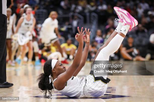 Guard Dana Evans of the Chicago Sky reacts after making a three-point basket at the buzzer at the end of the third period against the Los Angeles...