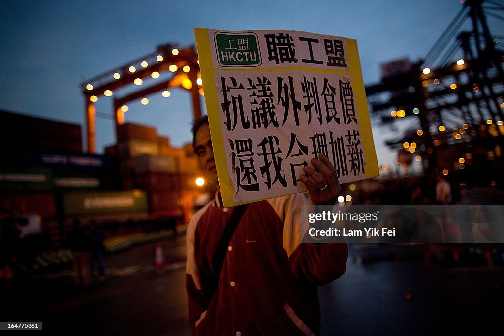 Dock Workers Stage Sit-In To Protest About Wages