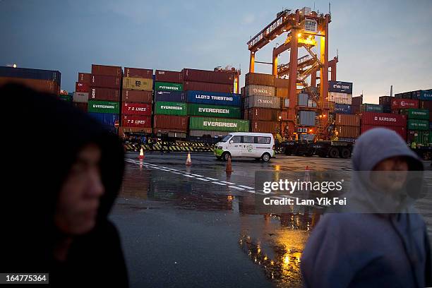 Over 100 dock workers stage a sit-in as they go on strike over pay at the Kwai Chung Container Terminal on March 28, 2013 in Hong Kong, China. The...