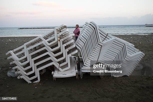 Disused sunloungers stand stacked on a beach in Limassol, Cyprus, on Wednesday, March 27, 2013. The ECB said on March 25 it won't stop the Cypriot...