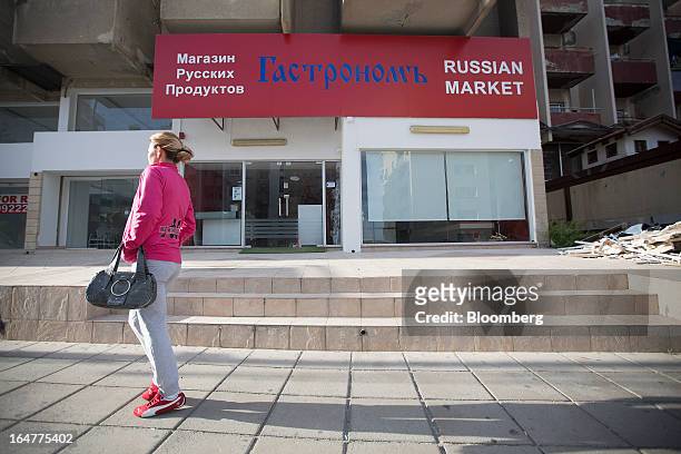 Pedestrian passes a Russian Market store in Limassol, Cyprus, on Wednesday, March 27, 2013. The ECB said on March 25 it won't stop the Cypriot...
