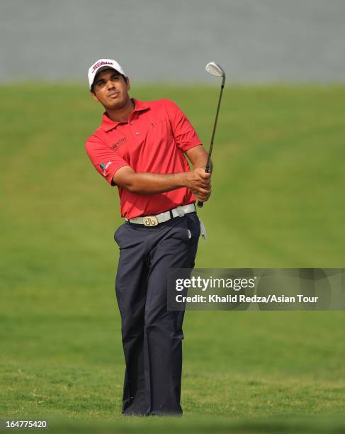 Gaganjeet Bhullar of India plays a shot during round one of the Chiangmai Golf Classic at Alpine Golf Resort-Chiangmai on March 28, 2013 in Chiang...