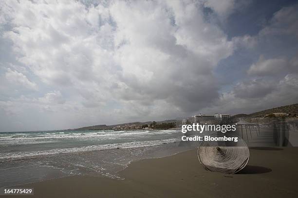 Parasol lies disused on the beach in Limassol, Cyprus, on Wednesday, March 27, 2013. The ECB said on March 25 it won't stop the Cypriot central bank...