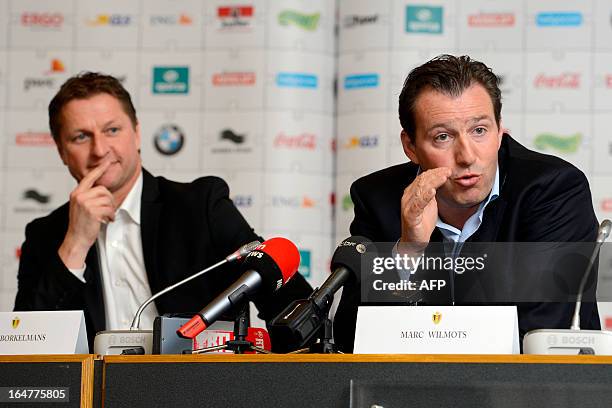 Belgian national football team assistant coach Vital Borkelmans and head coach Marc Wilmots give a press conference on March 27, 2013 in Brussels a...