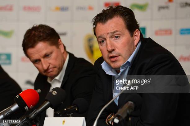 Belgian national football team assistant coach Vital Borkelmans and head coach Marc Wilmots give a press conference on March 27, 2013 in Brussels a...
