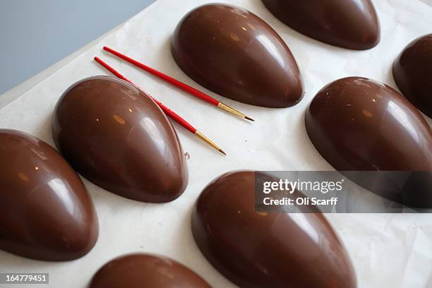 Easter eggs await decoration in the 'Melt' chocolate shop in Notting Hill on March 28, 2013 in London, England. Easter represents the busiest time of...