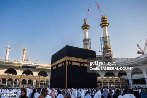 This picture taken on September 6, 2023 shows Muslim worshippers circumambulating around the Kaaba, Islam's holiest shrine, at the Grand Mosque in...