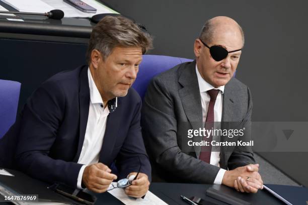 German Chancellor Olaf Scholz, wearing an eye patch due to a recent accident while jogging, and Climate Action Minister Robert Habeck attend debates...