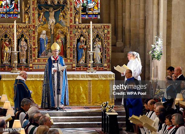 Queen Elizabeth II and Prince Phillip, Duke of Edinburgh stand during the Maundy service conducted by the Bishop of Worcester Dr John Inge, at Christ...