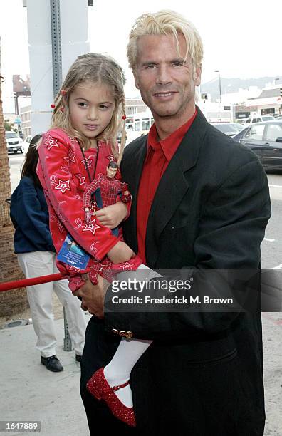 Actor Lorenzo Lamas and his daughter attend the film premiere of "Treasure Planet" at The Cinerama Dome on November 17, 2002 in Hollywood,...