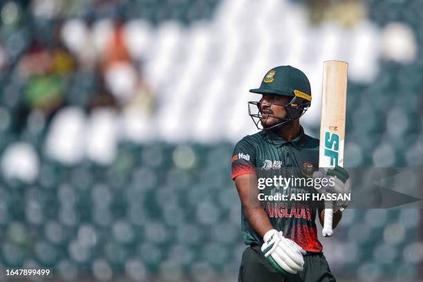 Bangladesh's Mohammad Naim looks on as he walks back to the pavilion after his dismissal during the Asia Cup 2023 one-day international cricket match...