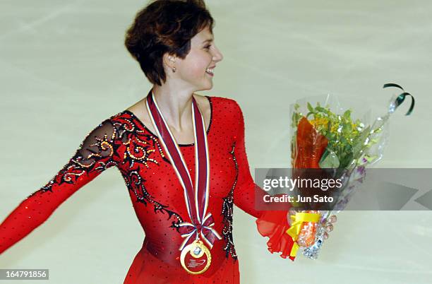 "Winner Irina Slutskaya receives flowers from her fans during an award ceremony for women's singles at Japan International Challenge figure skating...