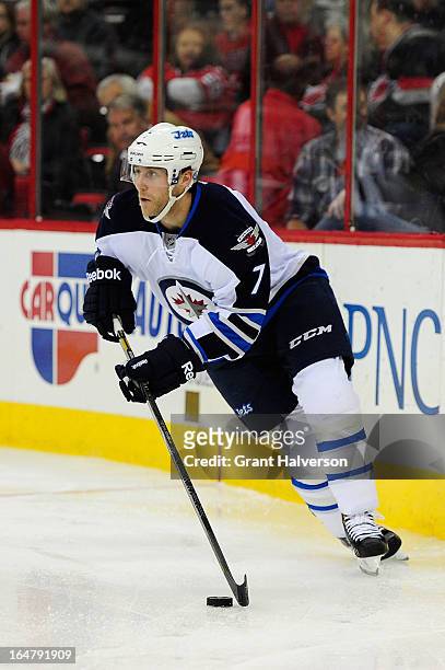 Derek Meech of the Winnipeg Jets of the Carolina Hurricanes during play at PNC Arena on March 26, 2013 in Raleigh, North Carolina. Winnipeg won 4-1.