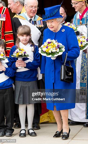 Queen Elizabeth II leaving Christs Church Cathedral in Oxford after The Royal Maundy Service on March 28, 2013 in Oxford, England.