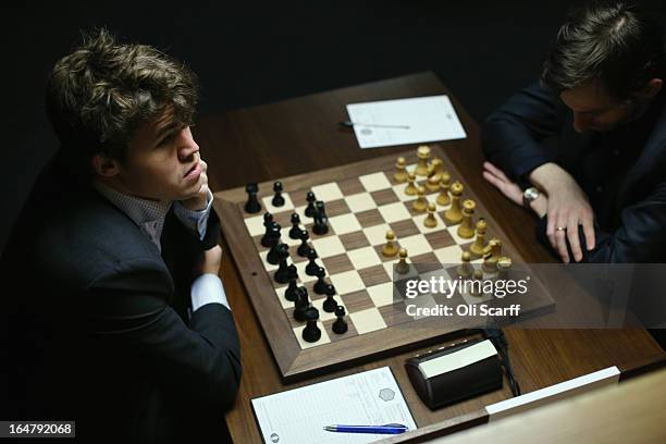 Magnus Carlsen , the world's number one chess player, plays Alexander Grischuk in the Candidates Tournament at the IET on Savoy Place on March 28,...