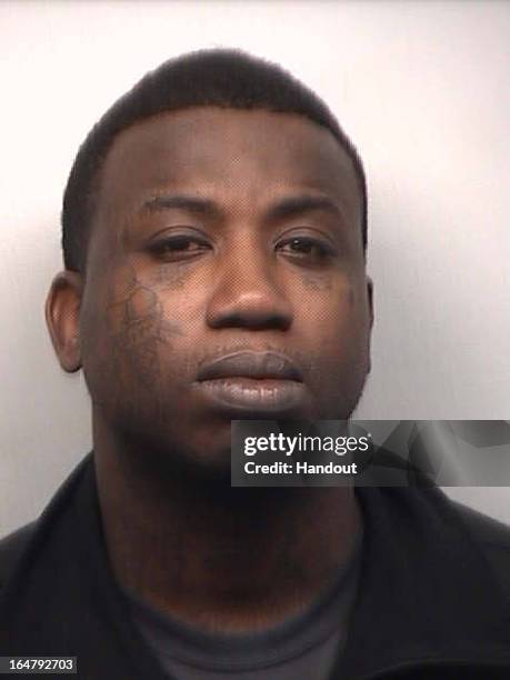 In this handout image provided by the Fulton County Sheriff's Office, rapper Gucci Mane, real name Radric Davis, is seen in a police booking photo...