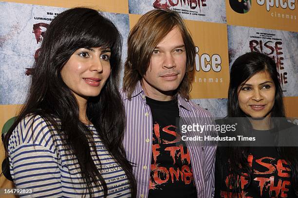 Kirti Kulhari, Luke Kenny & Devaki Singh pose for the photographs before attending a press conference for their upcoming film Rise of the Zombies at...