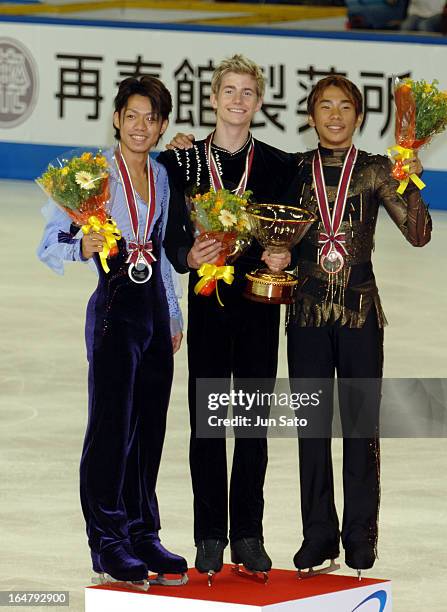 "Winner Jeffrey Buttle , second-placed Daisuke Takahashi and third-placed Nobunari Oda during an award ceremony for men's singles at Japan...