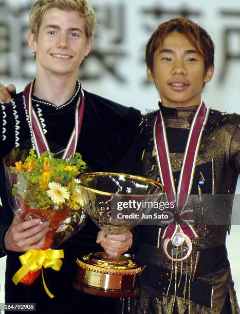 Winner Jeffrey Buttle and third-placed Nobunari Oda during an award ceremony for men's singles at Japan International Challenge figure skating cup...