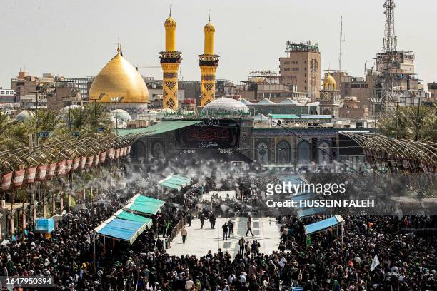 Shiite Muslim devotees gather between the shrines of Imam Abu al-Fadl al-Abbas and Imam Hussein, the Prophet Mohammed's grandsons, in Iraq's central...