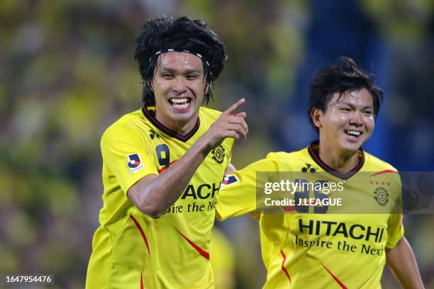 Masato Kudo of Kashiwa Reysol celebrates with his teammate Yusuke Kobayashi after scoring his team's second goal during the J.League J1 match between...