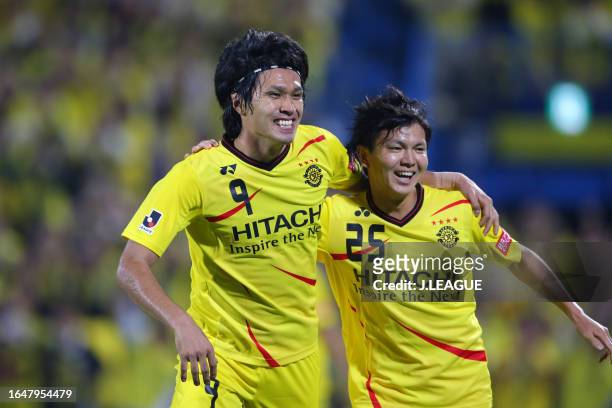 Masato Kudo of Kashiwa Reysol celebrates with his teammate Yusuke Kobayashi after scoring his team's second goal during the J.League J1 match between...