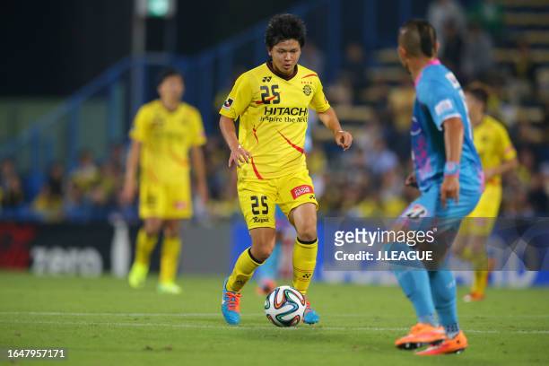 Yusuke Kobayashi of Kashiwa Reysol takes on Michihiro Yasuda st during the J.League J1 match between Kashiwa Reysol and Sagan Tosu at Hitachi Kashiwa...