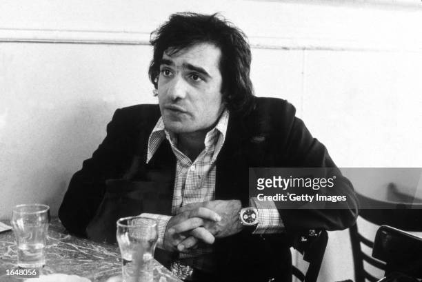 American film director Martin Scorsese sits in a cafe on Mulberry Street in Little Italy, during the making of his film, 'Mean Streets,' New York...