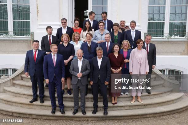 Members of the German federal government, including German Chancellor Olaf Scholz , pose for a group photo on the second of a two-day retreat of the...