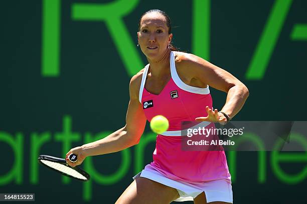 Jelena Janovic of Serbia returns a shot against Maria Sharapova of Russia during the Womens Semi Finals on Day 11 of the Sony Open at the Crandon...