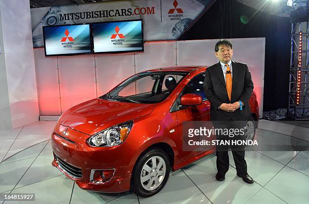 Yoichi Yokozawa, President and CEO, Mitsubishi Motors North America, in front of the 2014 Mistubishi Mirage, unveiled during the second press preview...