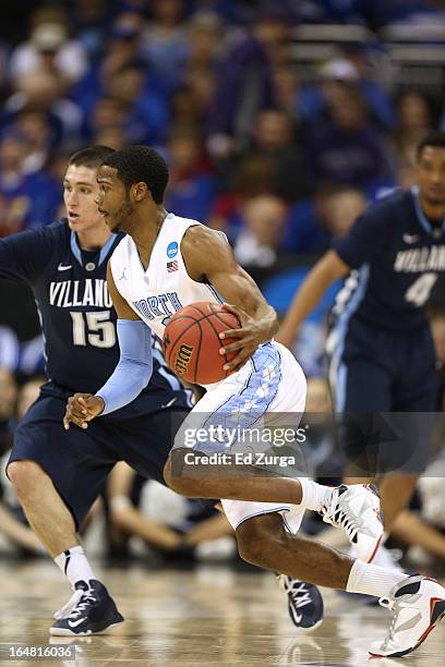 Dexter Strickland of the North Carolina Tar Heels works the ball against Ryan Arcidiacono of the Villanova Wildcats during the second round of the...