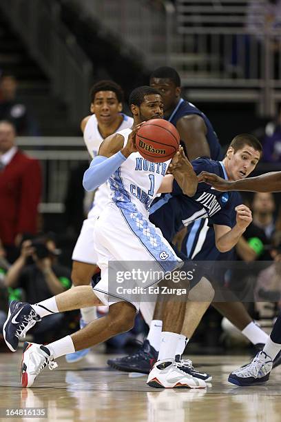 Dexter Strickland of the North Carolina Tar Heels passes against Ryan Arcidiacono of the Villanova Wildcats during the second round of the 2013 NCAA...