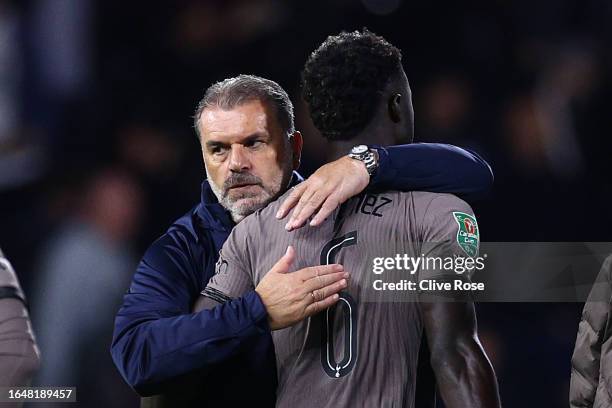 Ange Postecoglou, Manager of Tottenham Hotspur, consoles Davinson Sanchez of Tottenham Hotspur after losing in the penalty shoot out following the...