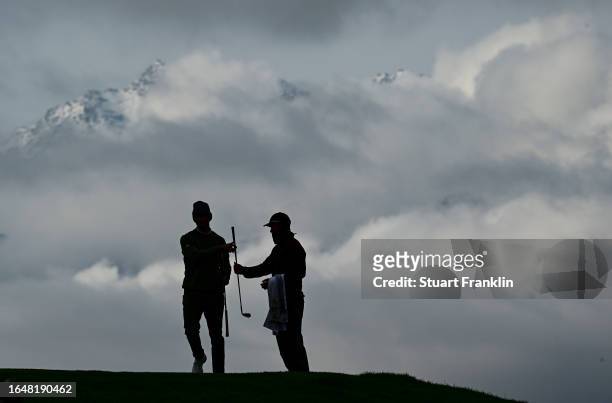 Rasmus Hojgaard of Denmark and caddie during the pro-am prior to the start of the Omega European Masters at Crans-sur-Sierre Golf Club on August 30,...