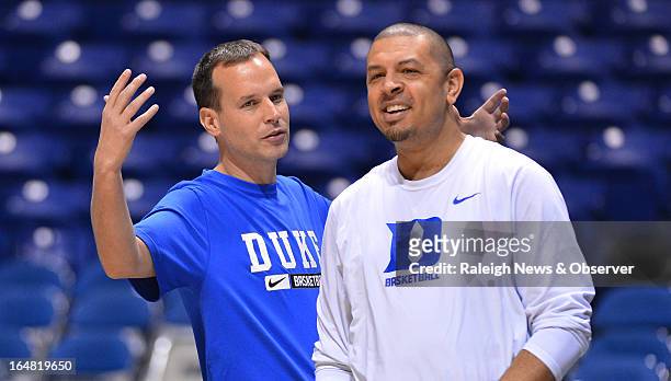 Duke associate head coach Chris Collins speaks with Duke assistant coach Jeff Capel before practice at Lucas Oil Stadium in Indianapolis, Indiana,...